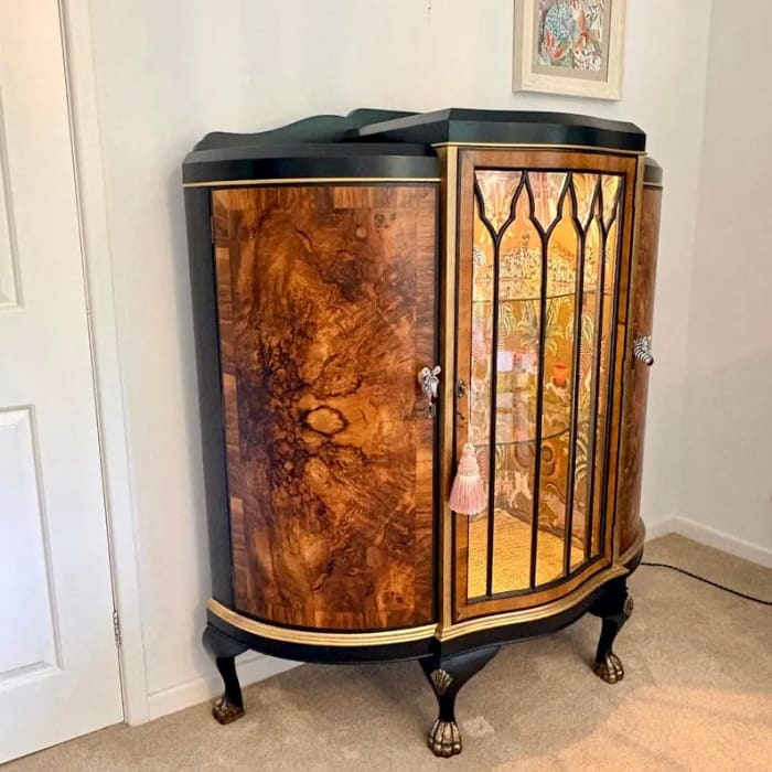 Side angle showing curved demi lune cabinet design