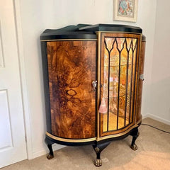 Side angle showing curved demi lune cabinet design