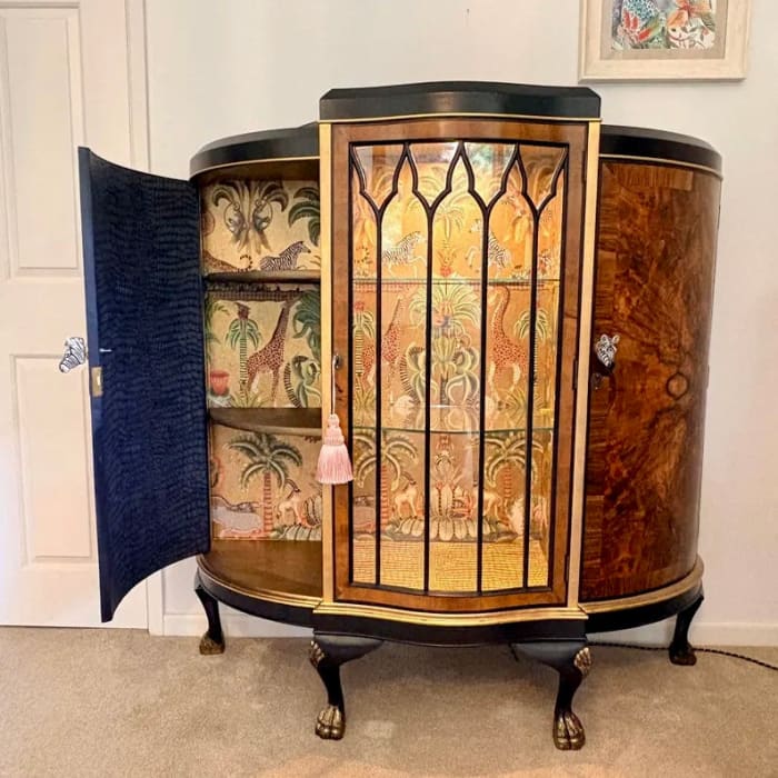 Antique drinks cabinet with illuminated central display section