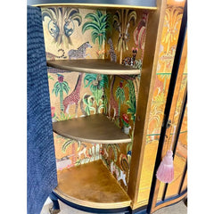 African-inspired interior inside antique burr walnut cabinet