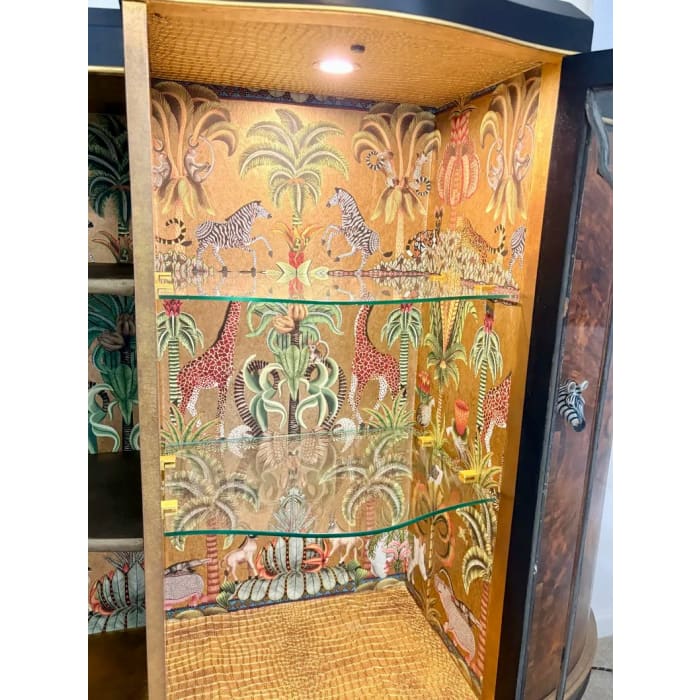 Display cabinet with concealed sensor-operated lighting system