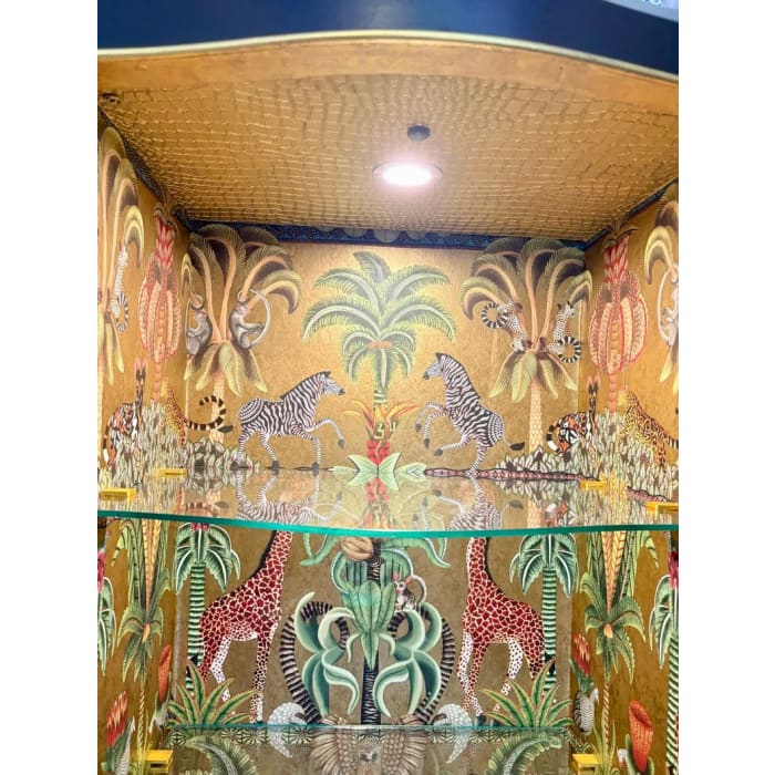Illuminated central compartment of antique display cabinet