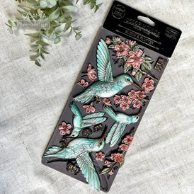 Decorative hummingbird and floral appliqué pieces made using Bloom & Flutter silicone mould by Redesign with Prima
