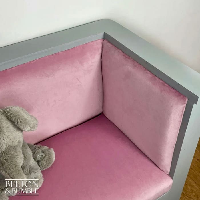 Close-up of plush pink velvet on chair of matching set
