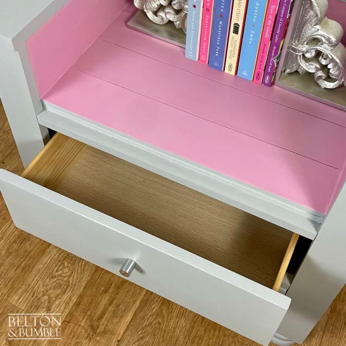 Interior of storage drawers on chair and bookcase for children’s books and toys