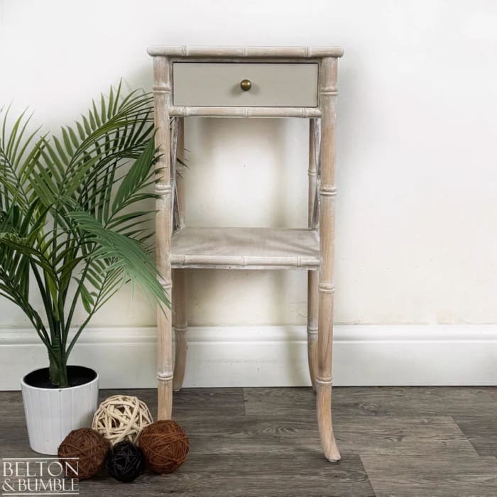 Front view of faux bamboo bedside table with single drawer and lower shelf by Belton & Bumble