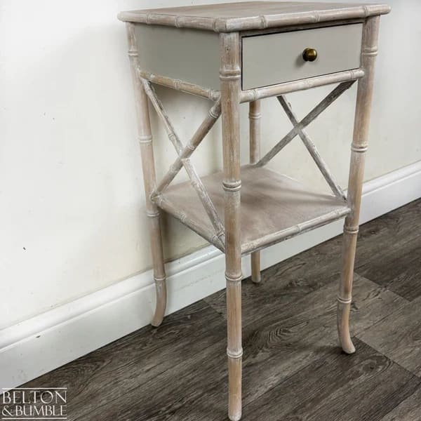 Angled view showing lime-waxed faux bamboo detailing and elegant silhouette