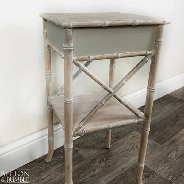 Rear view of faux bamboo bedside table with single drawer and lower shelf by Belton & Bumble