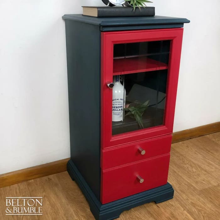 Side view of hand painted glass door drinks cabinet in blue and red, vintage display piece