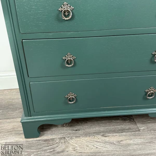 Original-style metal ring handles detail on jewel green chest of drawers