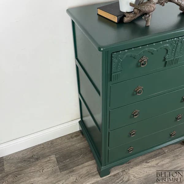 Side profile of jewel green chest of drawers with elegant proportions and timber grain