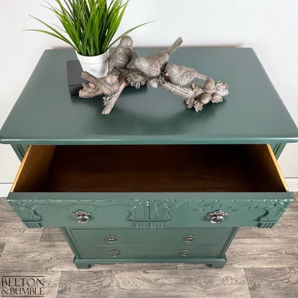 Drawer interior of jewel green chest of drawers treated with citrus-scented wood balm