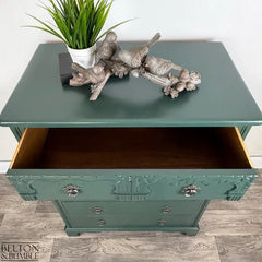 Drawer interior of jewel green chest of drawers treated with citrus-scented wood balm