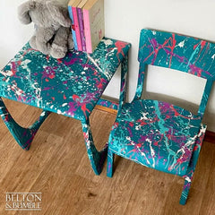 Close-up of Paintsplat hand-painted effect on teal kids table & chair set