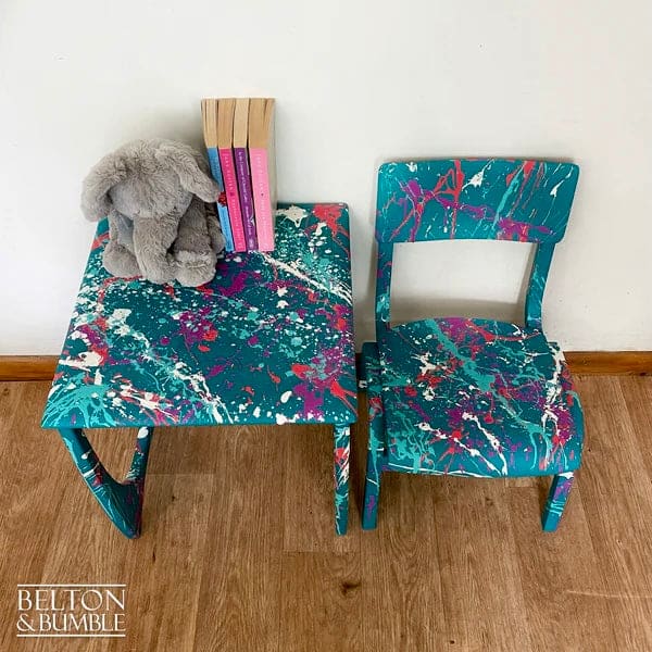 Top view of teal kids table highlighting colourful Paintsplat design and wax finish