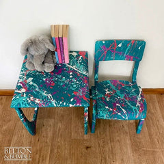 Top view of teal kids table highlighting colourful Paintsplat design and wax finish