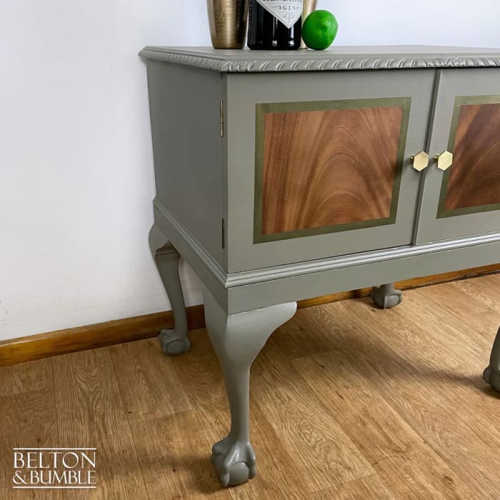 Side profile of mahogany cocktail cabinet with elegant cabriole legs and ball-and-claw feet