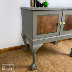 Side profile of mahogany cocktail cabinet with elegant cabriole legs and ball-and-claw feet