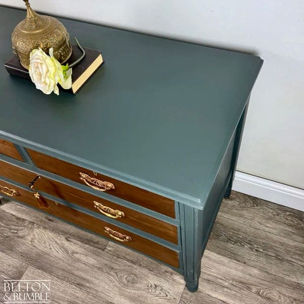 Vintage solid wood chest of drawers with green painted finish and warm tones