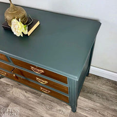 Vintage solid wood chest of drawers with green painted finish and warm tones