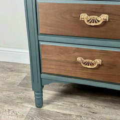 Turned legs detail on solid wood mahogany and walnut chest of drawers