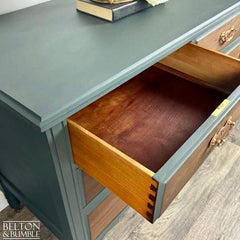 Close-up of dovetail joint drawer construction in restored vintage chest