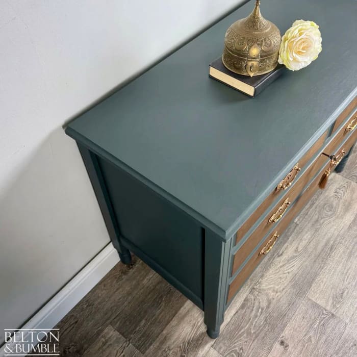 Side profile of vintage mahogany and walnut chest of drawers in green finish