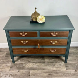 Angled view of restored green chest of drawers with mahogany and walnut detail