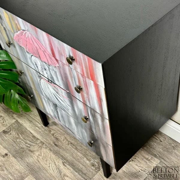 Side profile of hand-painted mid-century chest of drawers in jet black