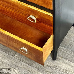 Close-up of drawer interiors on restored mid-century modern chest of drawers with teak detailing