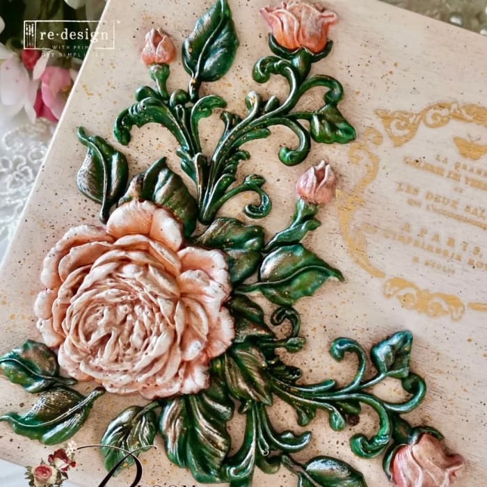 Rosewood Romance floral appliqué pieces cast from Redesign with Prima silicone mould, painted in soft peach tones for furniture upcycling