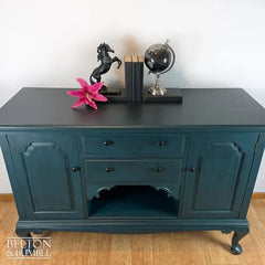 Downward view of solid wood teal sideboard with drawers and cupboards by Belton & Bumble
