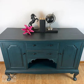 Downward view of solid wood teal sideboard with drawers and cupboards by Belton & Bumble