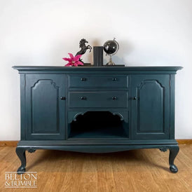 Front view of solid wood teal sideboard with drawers and cupboards by Belton & Bumble