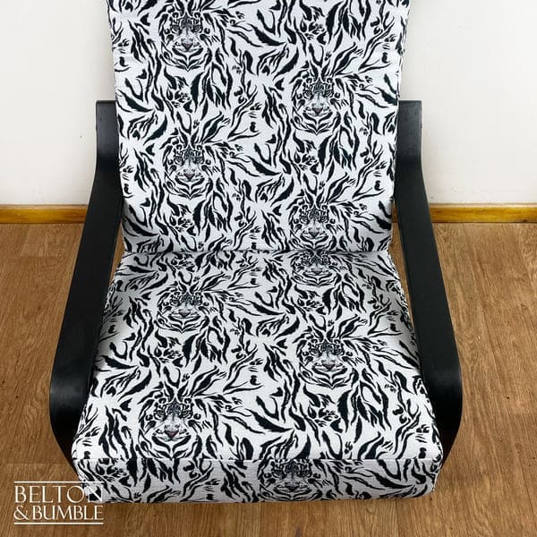 Close-up of tiger print upholstery on vintage rocking chair seat by Belton & Bumble, UK