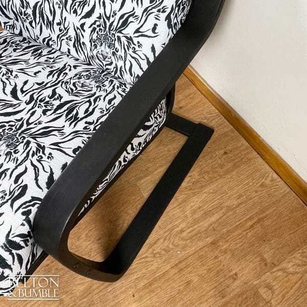 Close-up of arm on vintage rocking chair seat by Belton & Bumble, UK