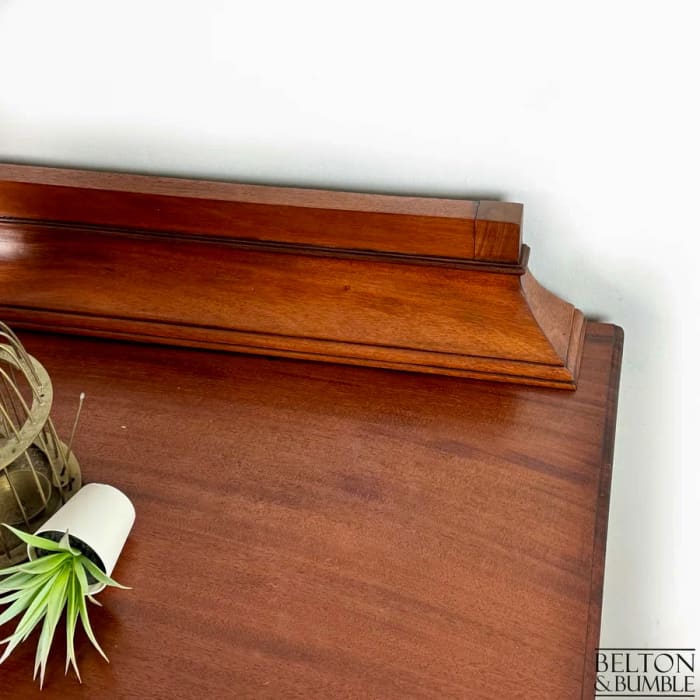 Gallery back detail on restored vintage mahogany chest
