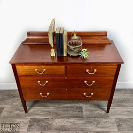 Top surface and gallery back of restored mahogany chest of drawers